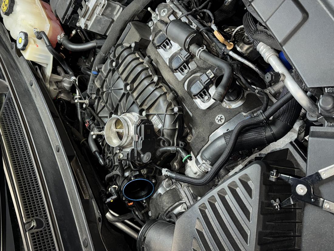 Engine bay during an alternator and charging system repair