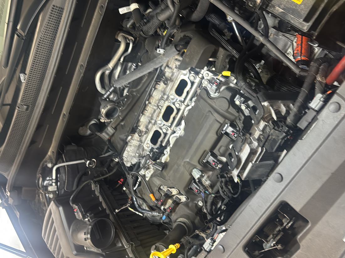Engine bay during a starter motor replacement